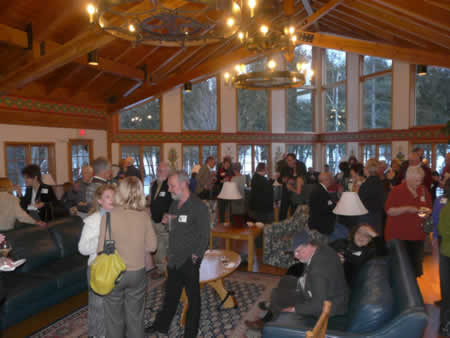Door County Land Trust Feast by the Fire guests gather prior to dinner in the Great Hall at Bjoklunden Lodge. Photo credit: Julie Schartner